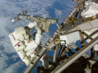 Illustration for article titled Fragile Humans Spacewalk To Upgrade Space Station Communications
